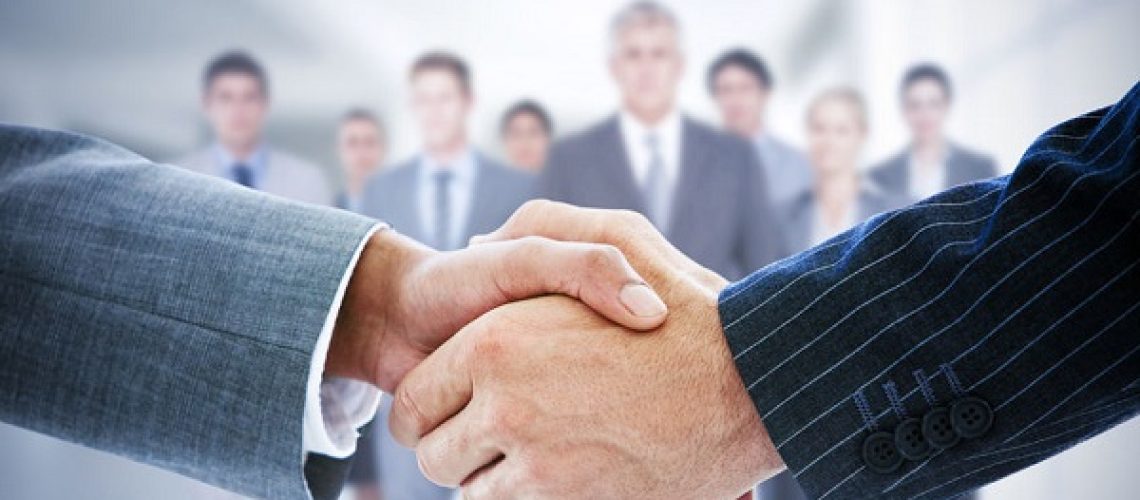 42323560 - composite image of business people shaking hands